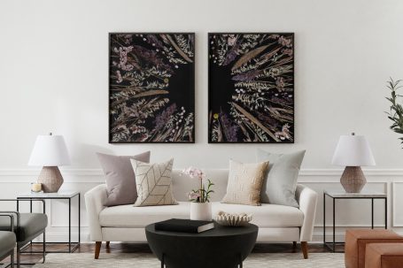 Stylish living room featuring floral artwork pair, preserving delicate flowers on black background, enhancing modern interiors.